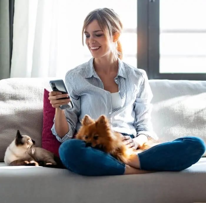 Dog-Cat-Woman-Couch-Phone-Pet-Sitting