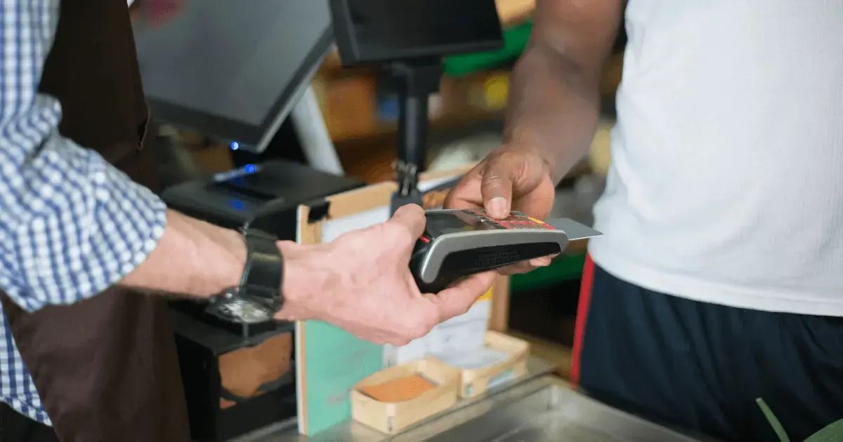 person checking out at a register